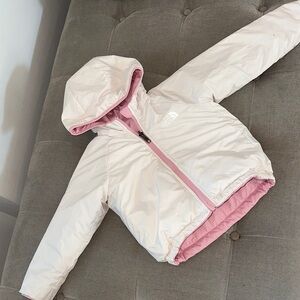 North face Kids Pink and White Hooded Jacket reversible.